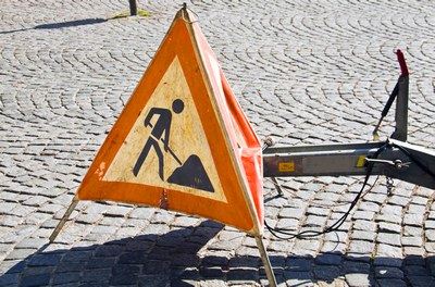 road in maintenance signal on a urban pavement