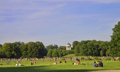MUNICH, GERMANY-AUGUST 15, 2013. People enjoy the sun on the green of the Englischer Garten in Munich on a summer holiday day